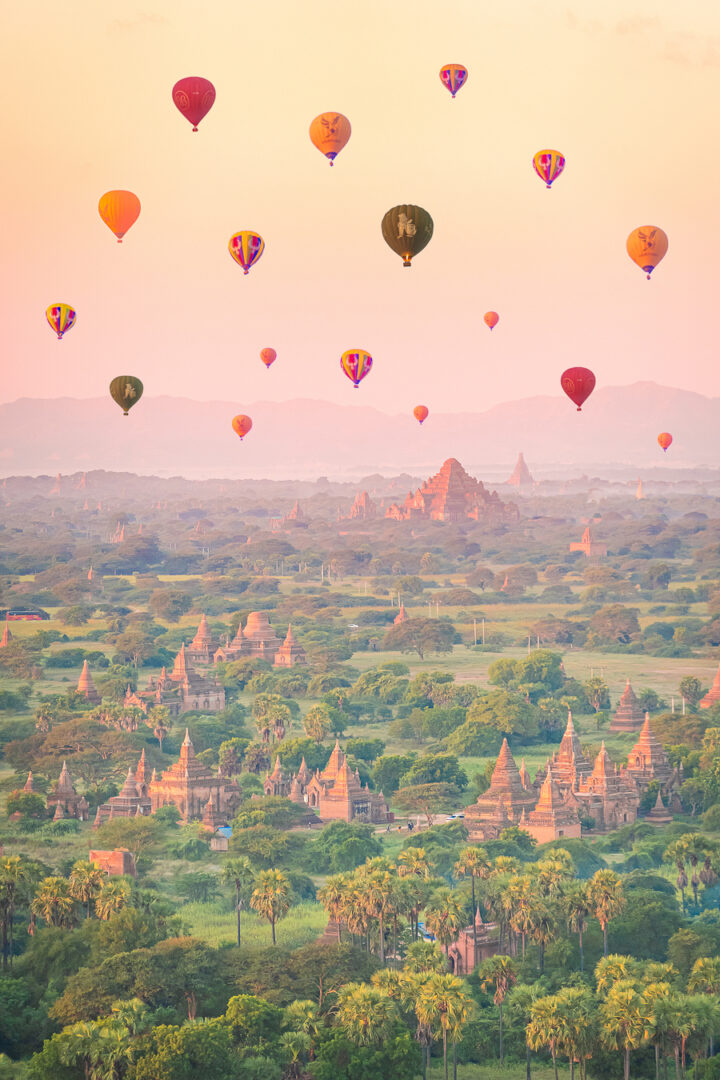 Colorful hot air balloons over Bagan, Myanmar at sunrise.