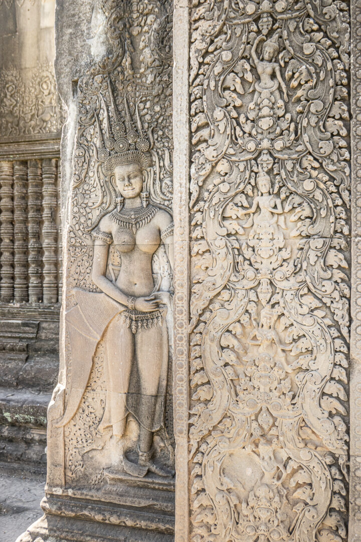 Detailed carvings on the walls of Angkor Wat