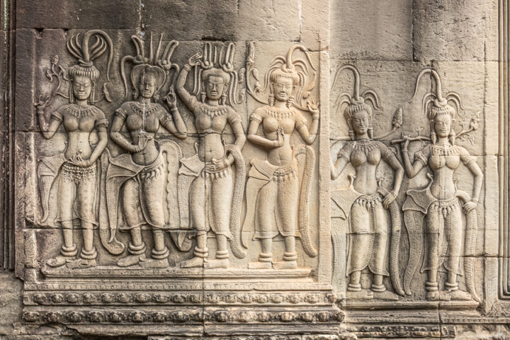 Detailed carvings on the walls of Angkor Wat