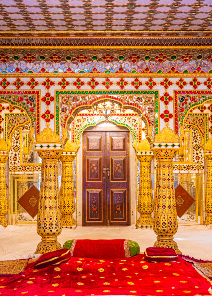 A red and gold room inside one of the palaces in Jaipur, India.