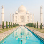 Image of the Taj Mahal from the edge of the reflecting pool.