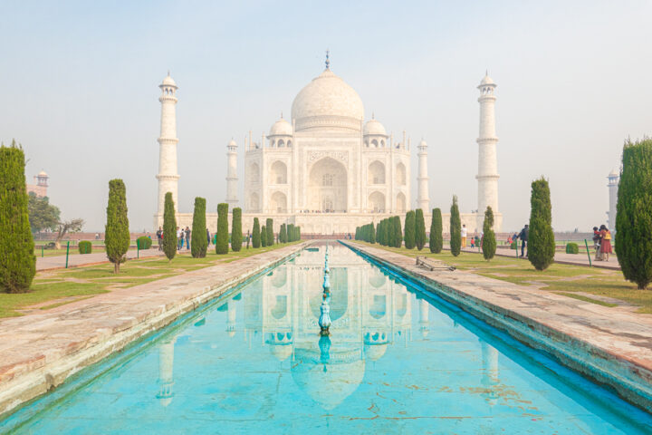 Image of the Taj Mahal from the edge of the reflecting pool.
