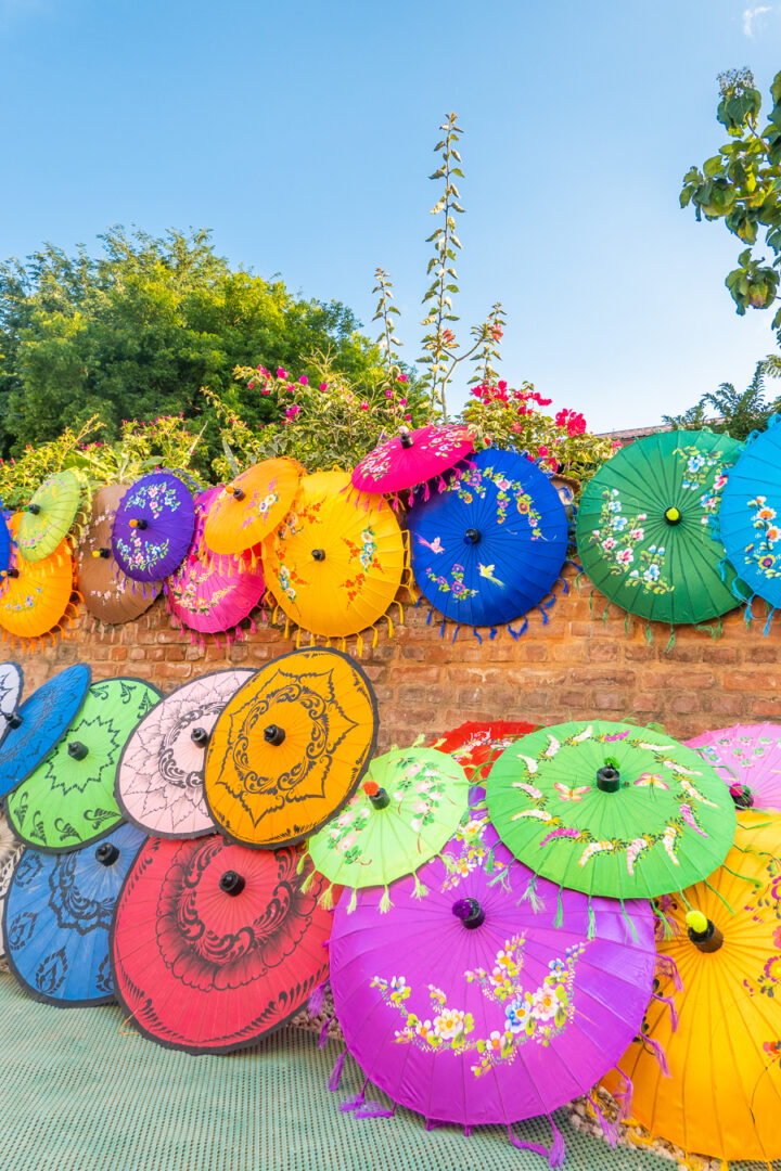 Brightly colored umbrellas for sale outside of the White Temple in Myanmar.