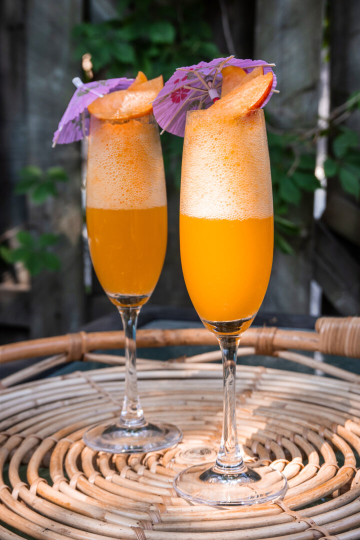 Sparkling Peach Juice served in champagne glasses