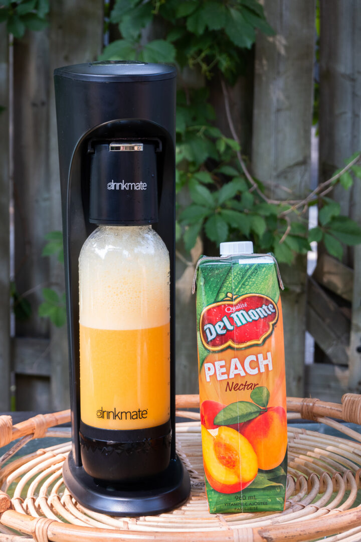 Sparkling peach juice made with Drinkmate Beverage Carbonation Maker