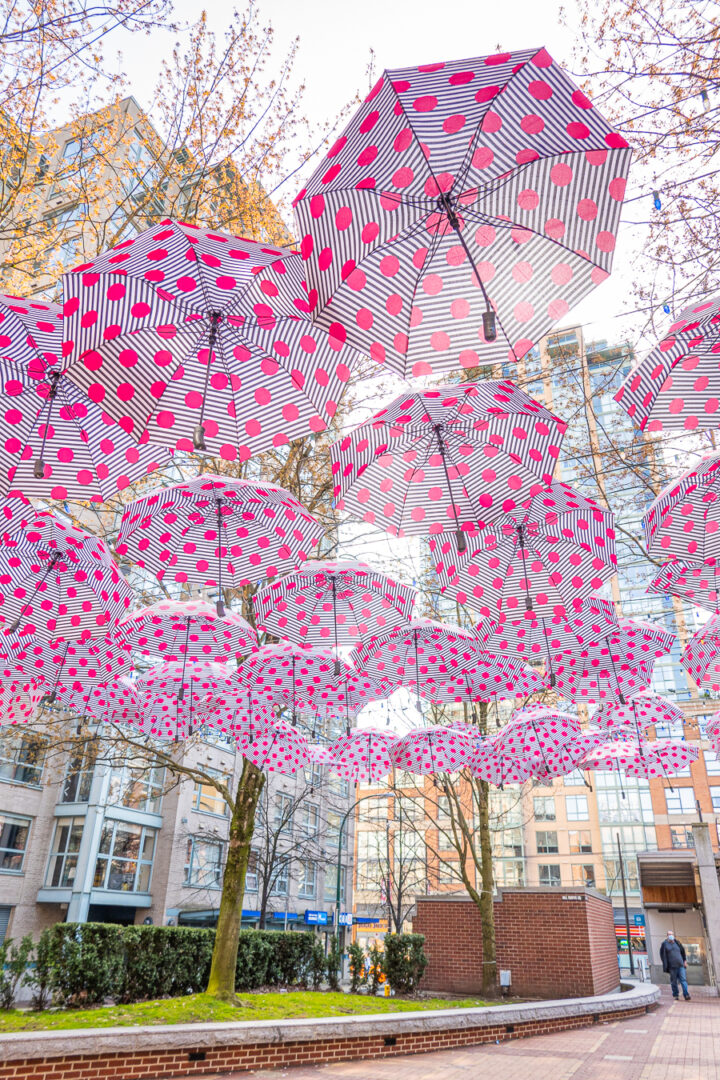 pink polka dot umbrellas hanging from above